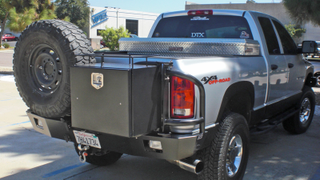 Not nearly as useful being on the back. You use the back more than the front! Tail gate is used more than the hood!